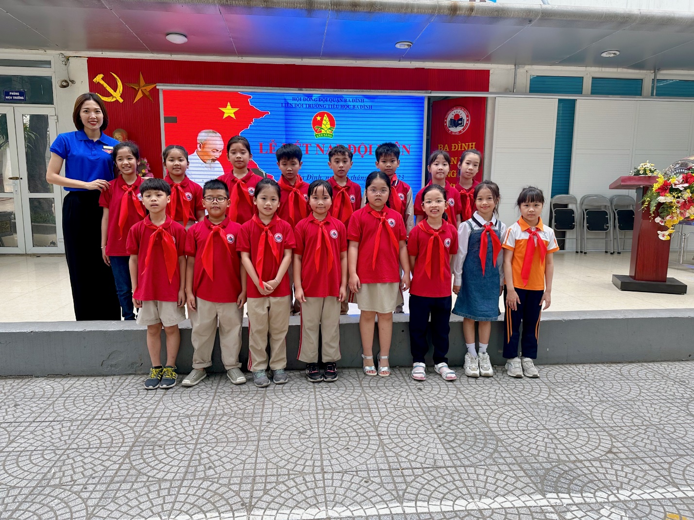 A group of children in red shirts

Description automatically generated